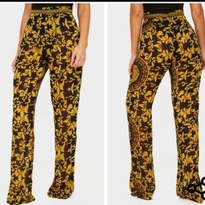 PRETTY LITTLE THING BLACK CHAIN PRINT BEACH FLARES.